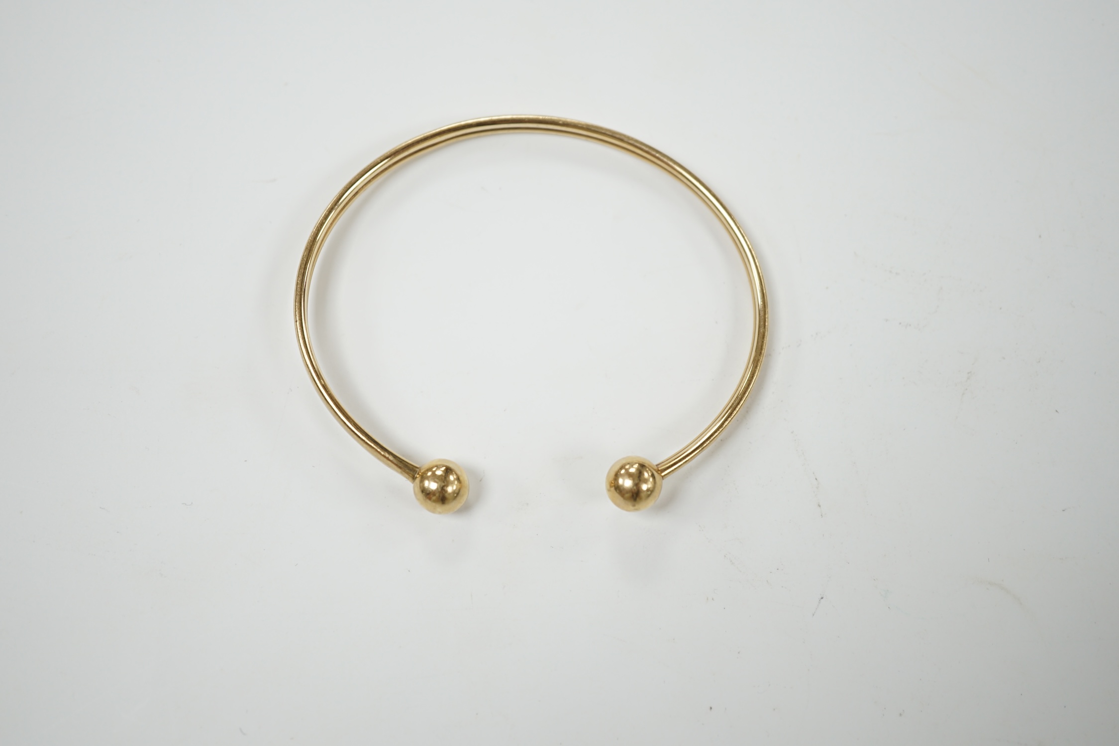 A 9ct gold torque bangle, 4.7 grams. Condition - fair to poor